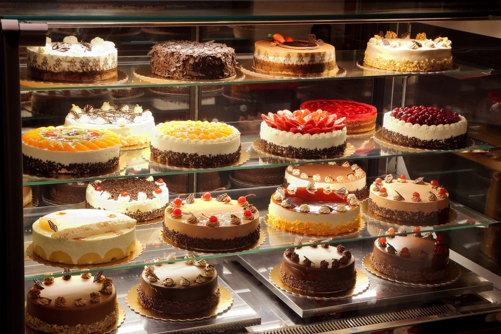 Different,Types,Of,Cakes,In,Pastry,Shop,Glass,Display